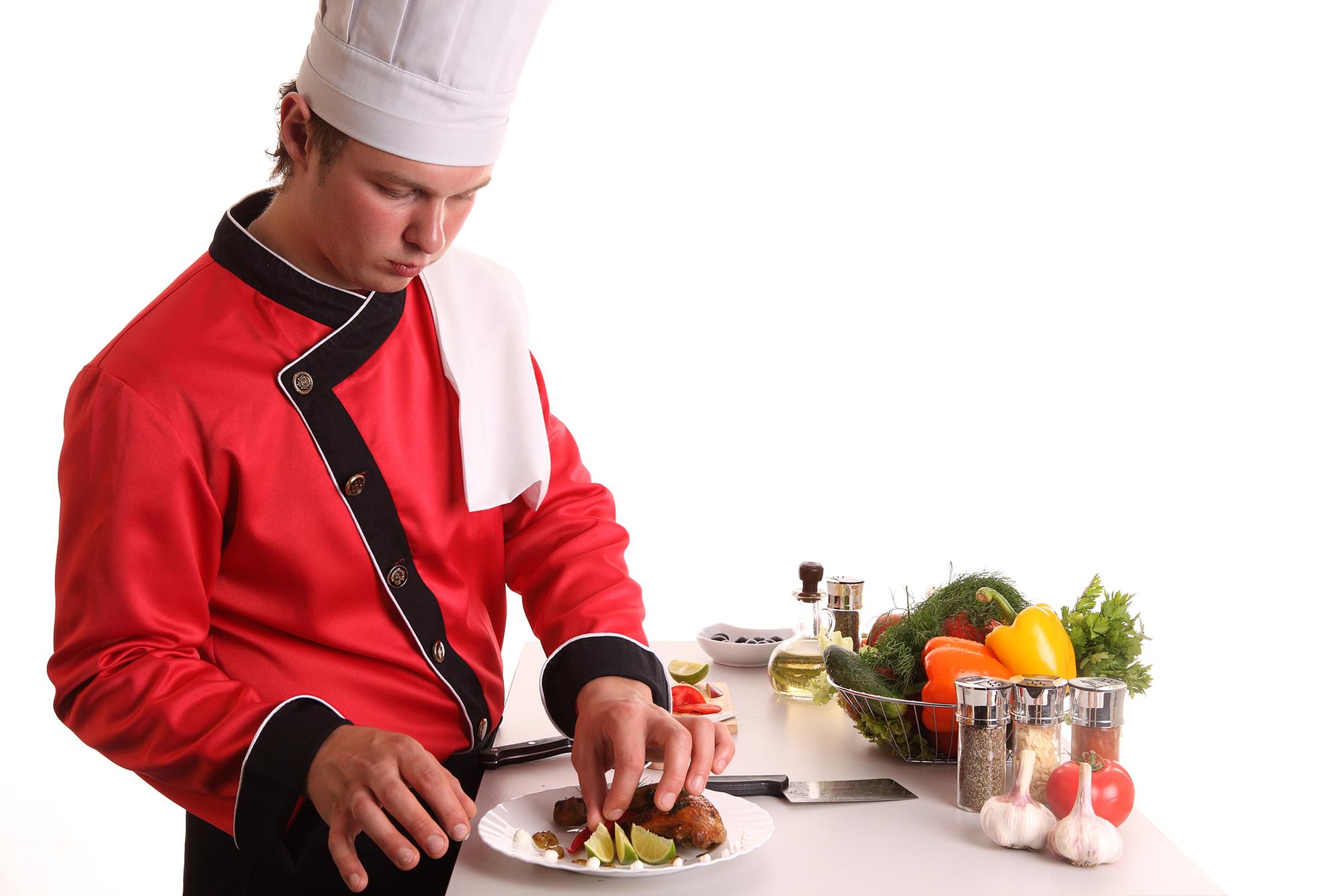Chef arranging mise en place in elegant kitchen