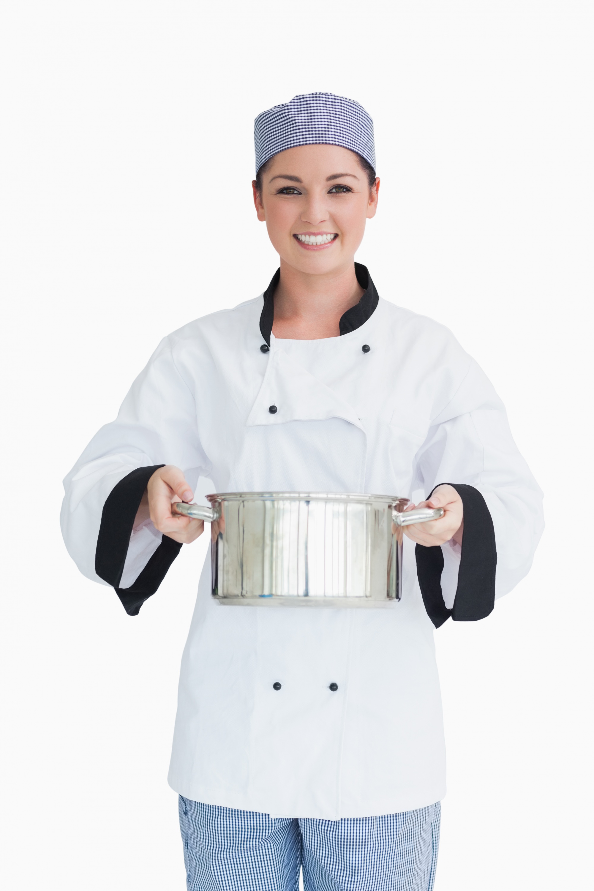 Assistant preparing trays in production line